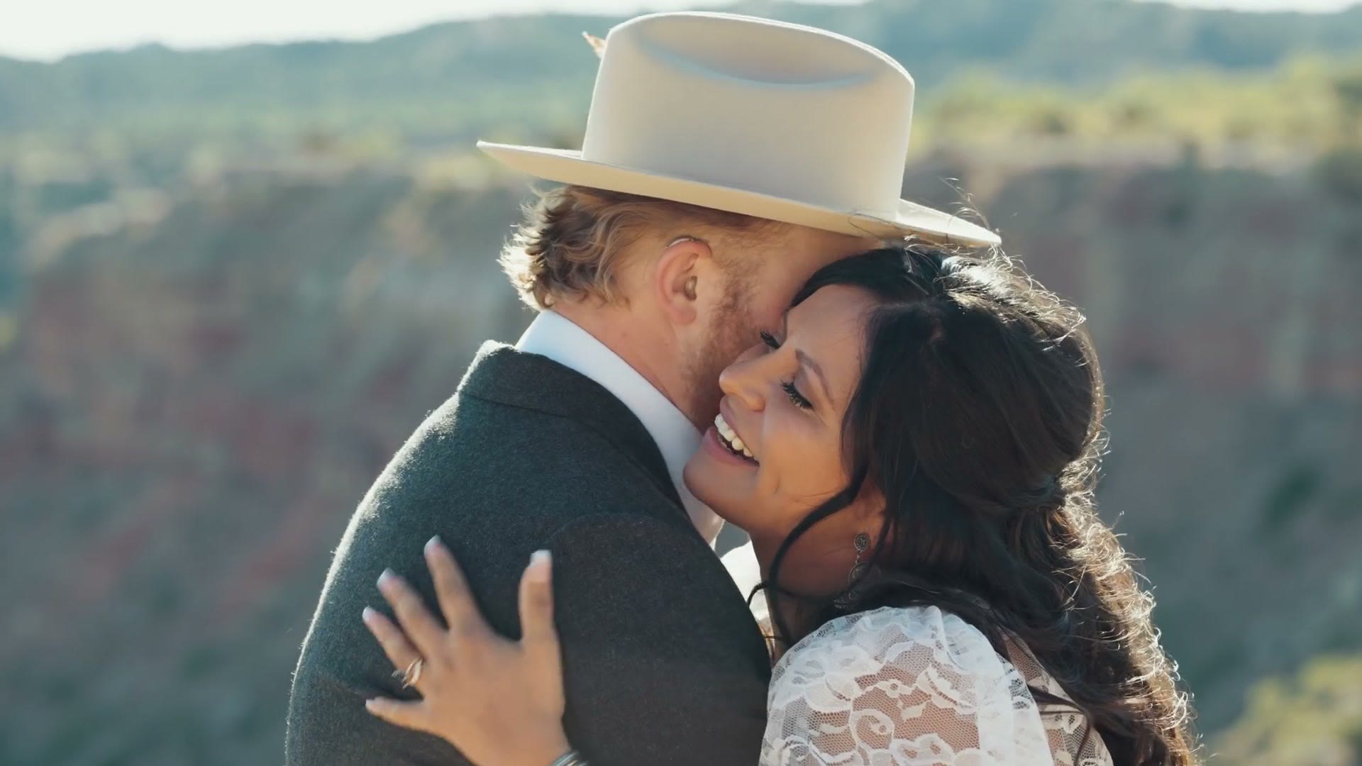The couple embracing at the overlook