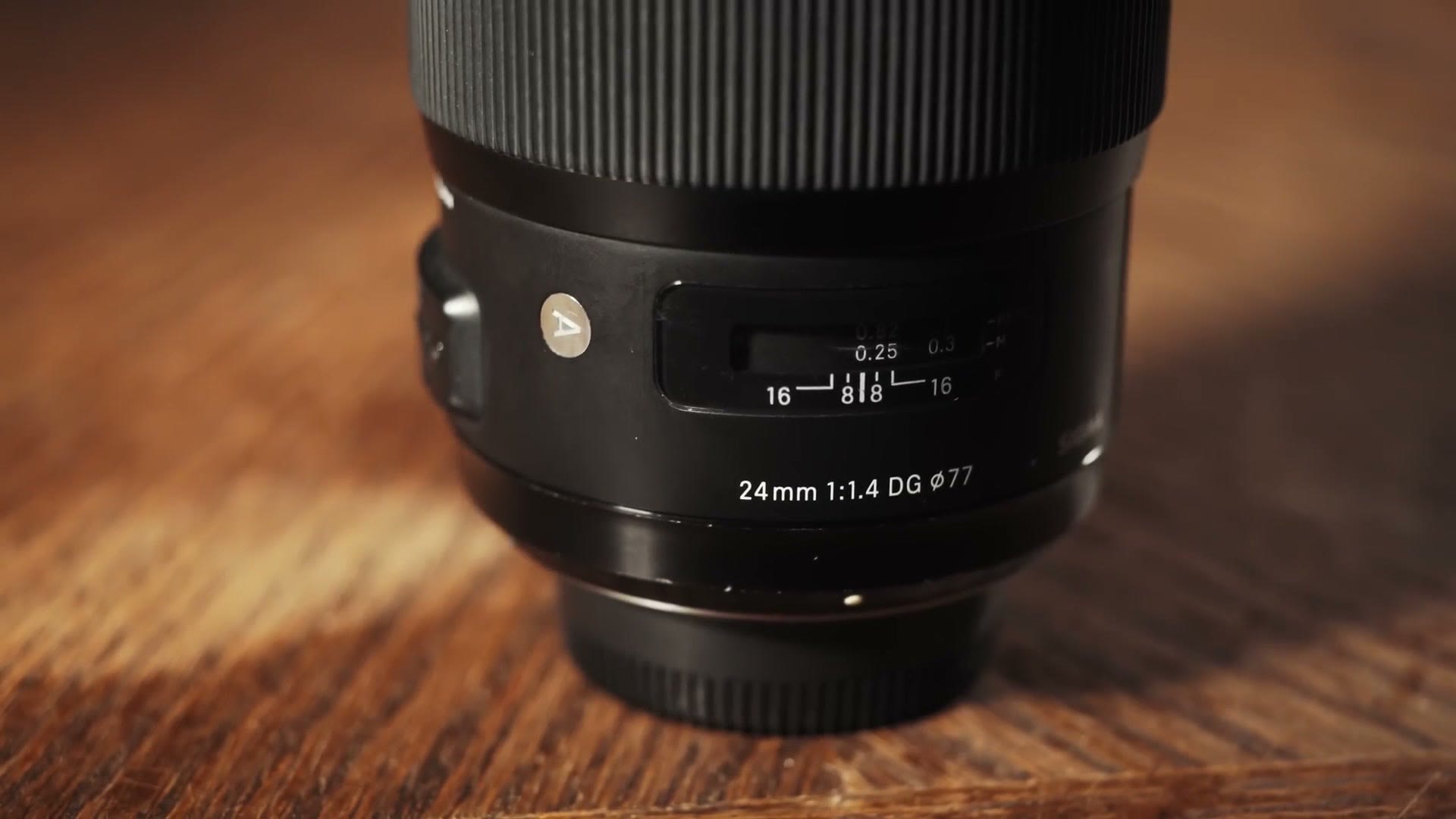 A close up of the Sigma 24mm barrel showing the distance scale and the marking 24mm 1:1.4 DG 77