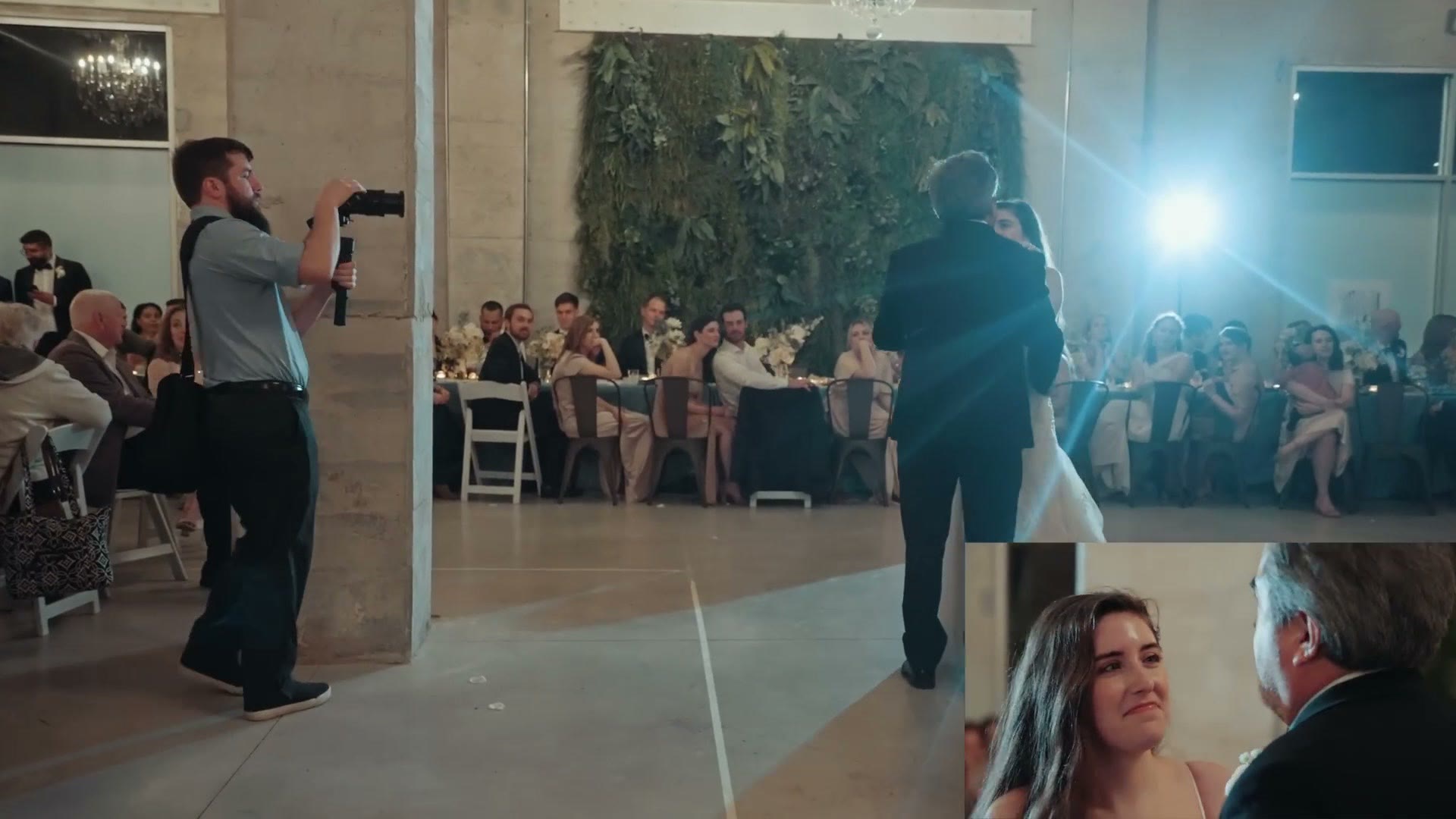 Matt filming a first dance from the side of the dance floor with a light behind the couple