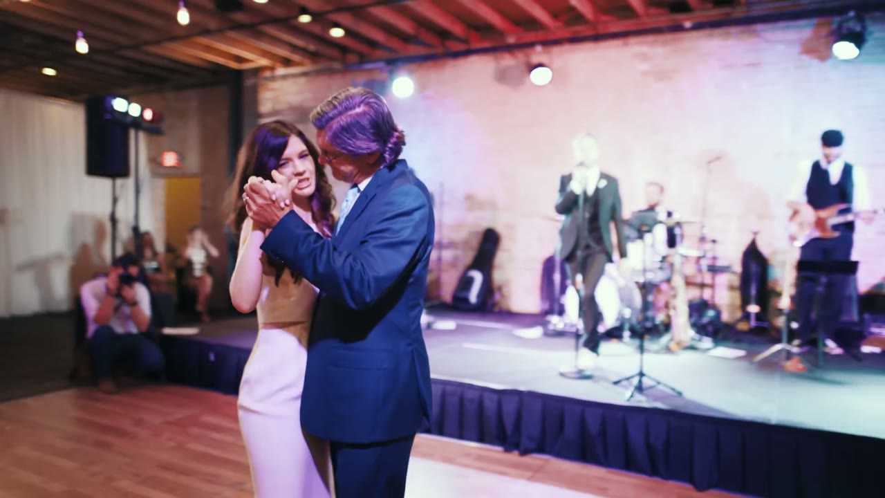 The couple's first dance in front of a live band on stage
