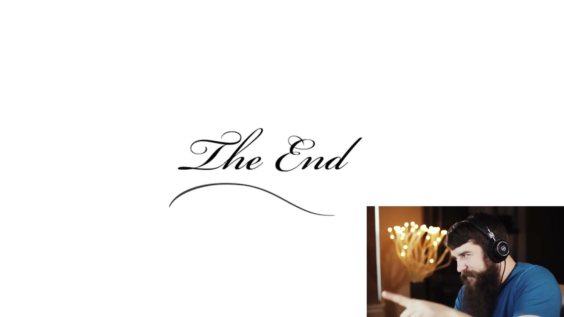 A white end card reading The End in a script typeface with a decorative flourish underneath.