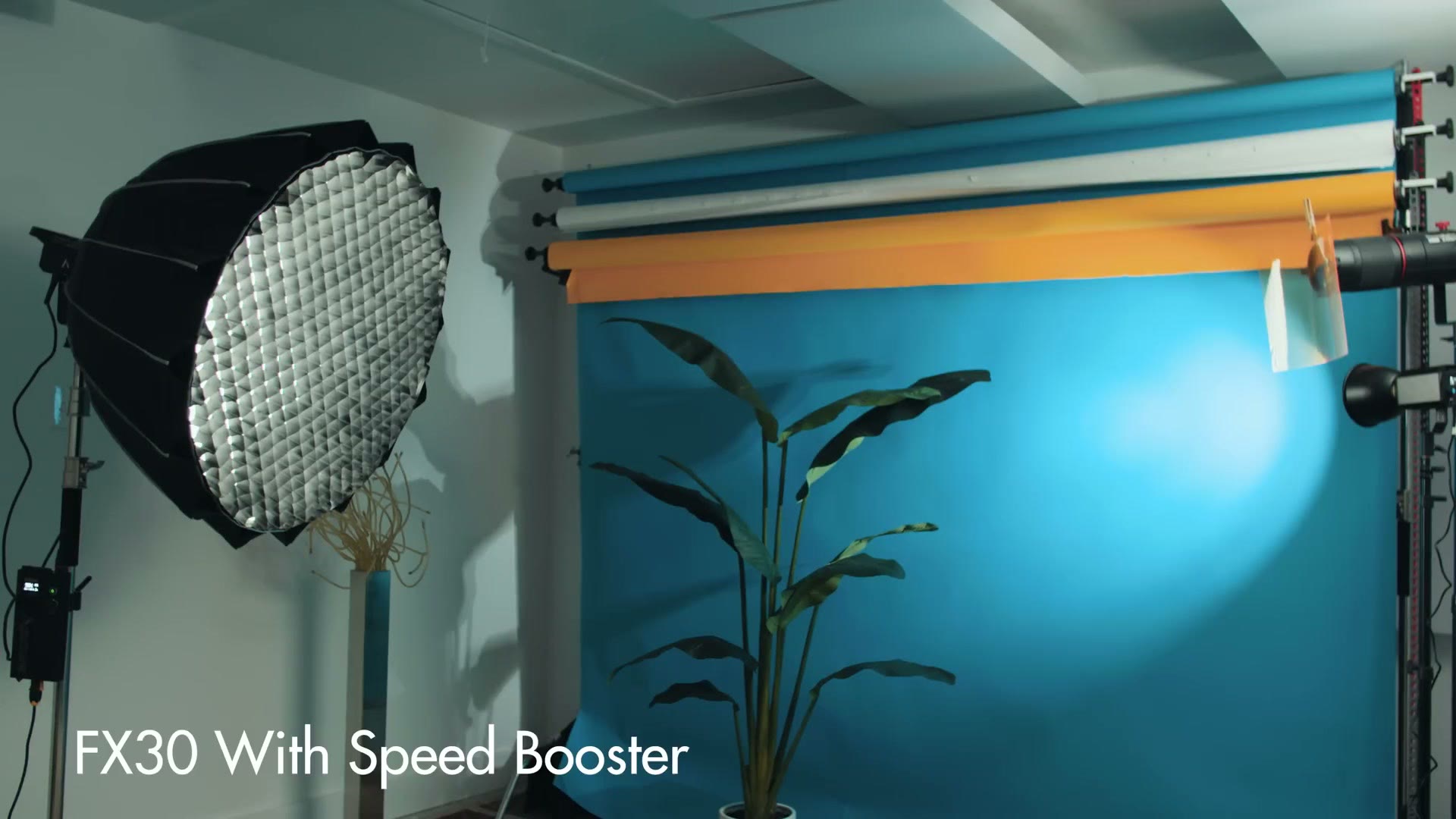 A test shot labeled FX30 With Speed Booster showing a wider field of view