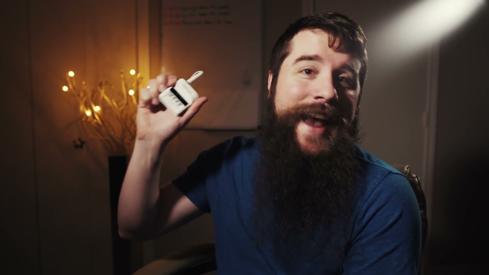 Matt holding up a white Tascam DR-10L audio recorder