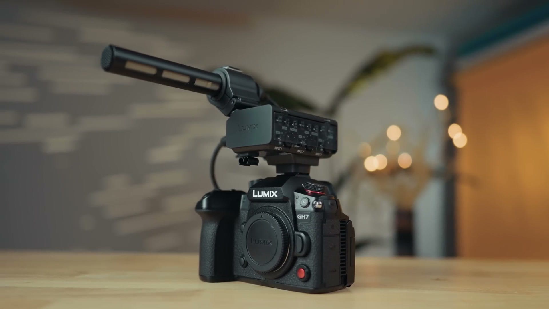Panasonic GH7 with a shotgun microphone mounted on the DMW-XLR2 audio adapter