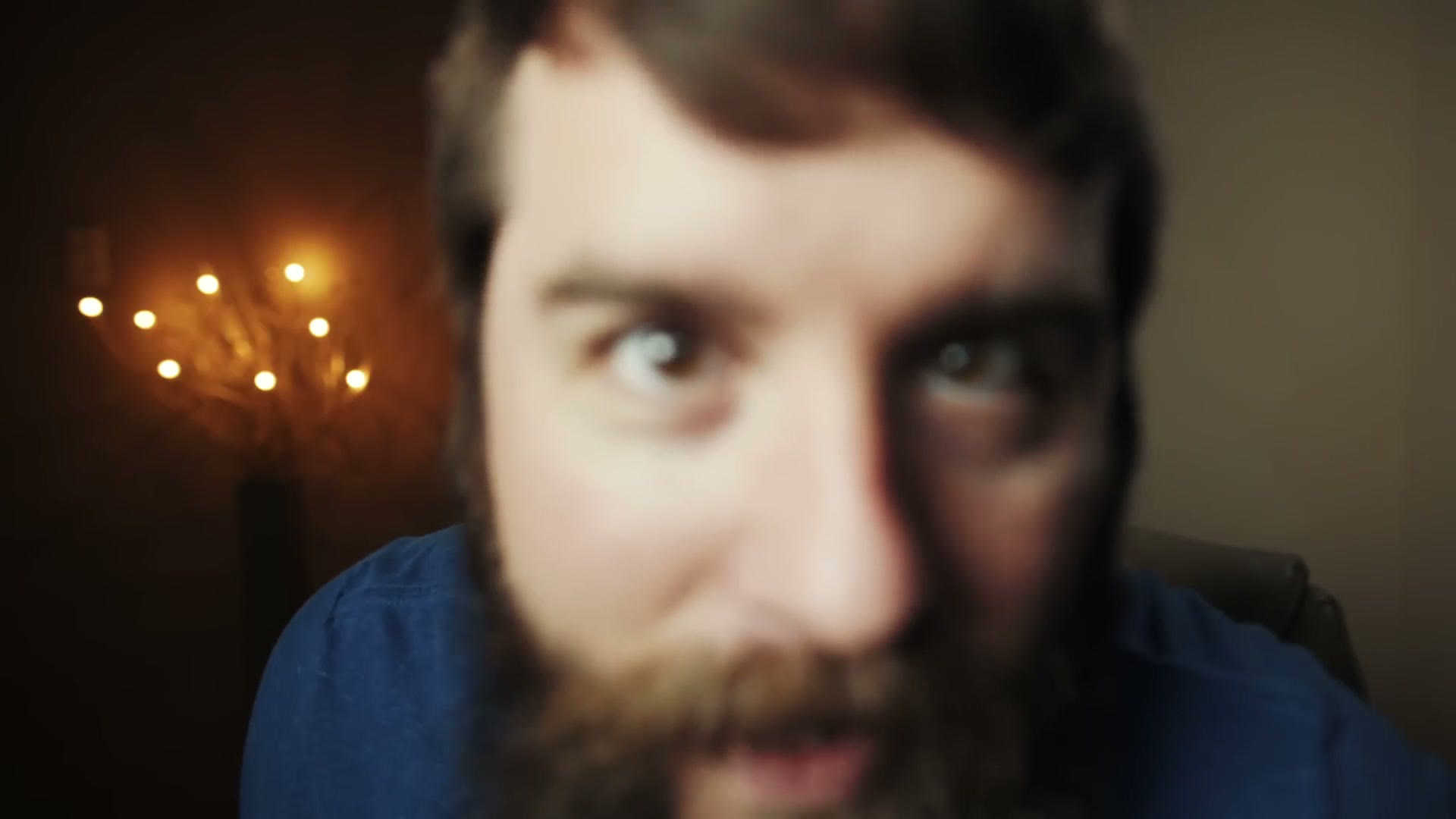 Matt leaning close to the camera and going completely out of focus, demonstrating the plane of focus
