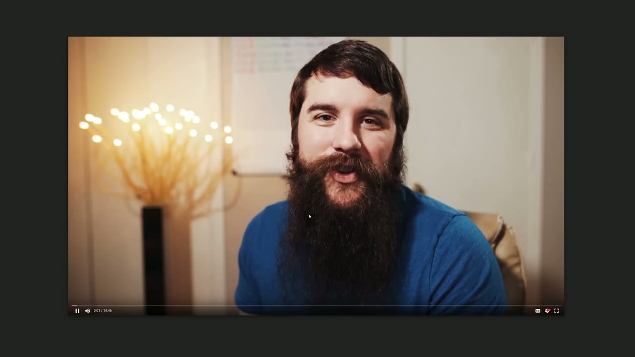 Paused video player frame of Matt talking to camera, playback controls visible along the bottom