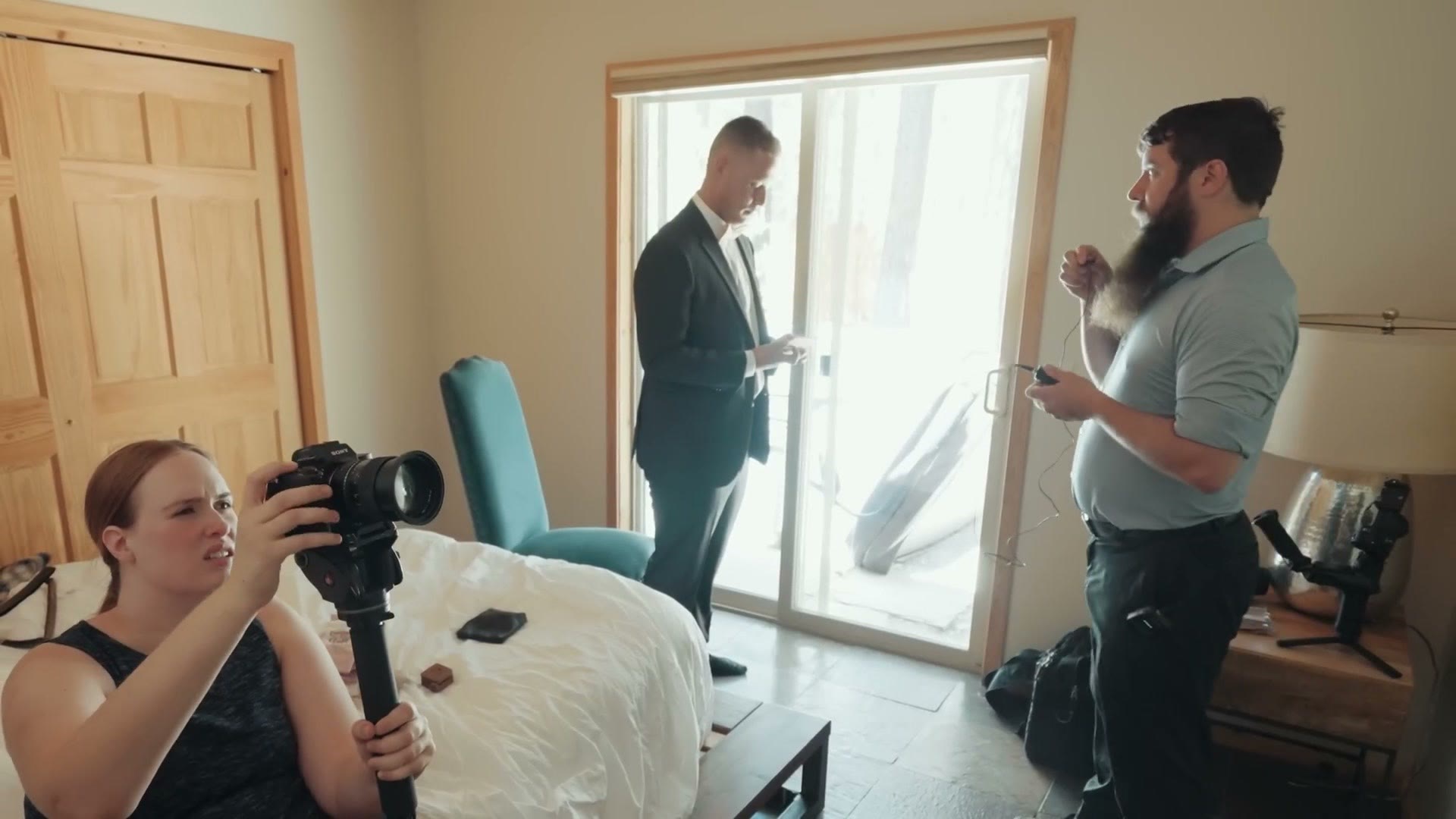 The groom reading his letter to the bride while being filmed on a 50mm