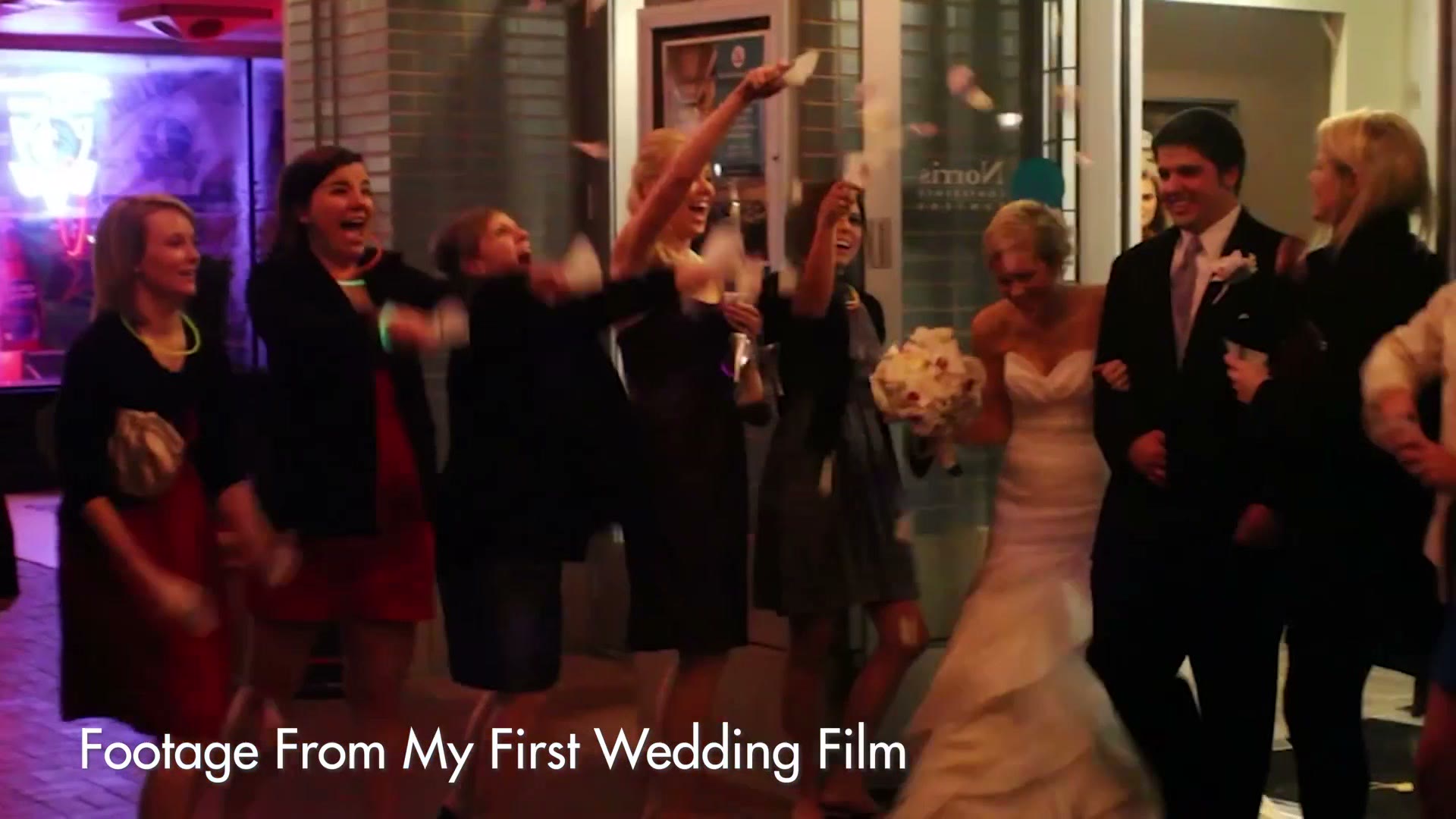 A bride and groom running out through cheering guests throwing confetti at night, labelled Footage From My First Wedding Film