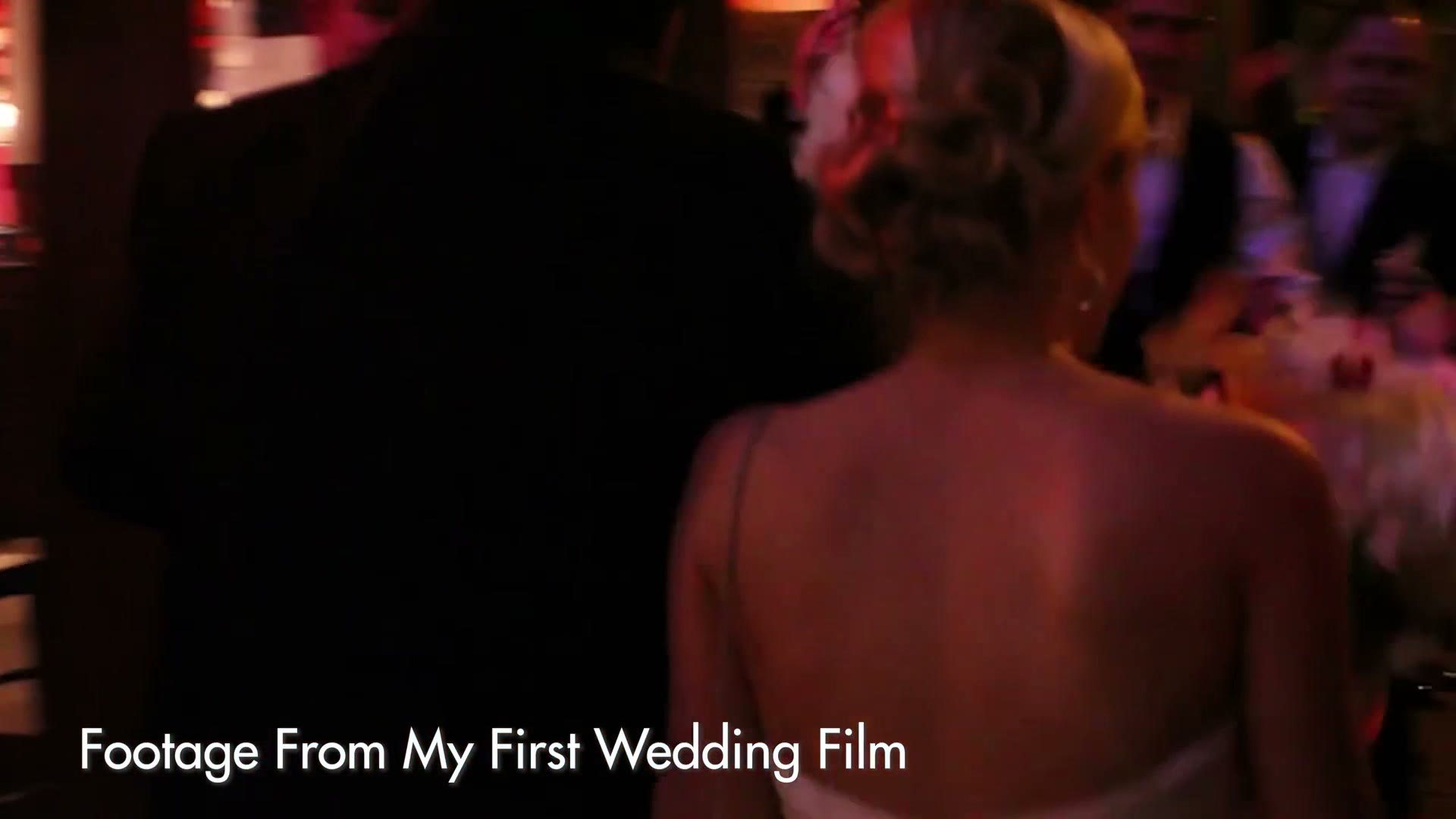 A dimly lit reception with a bride seen from behind, labelled Footage From My First Wedding Film