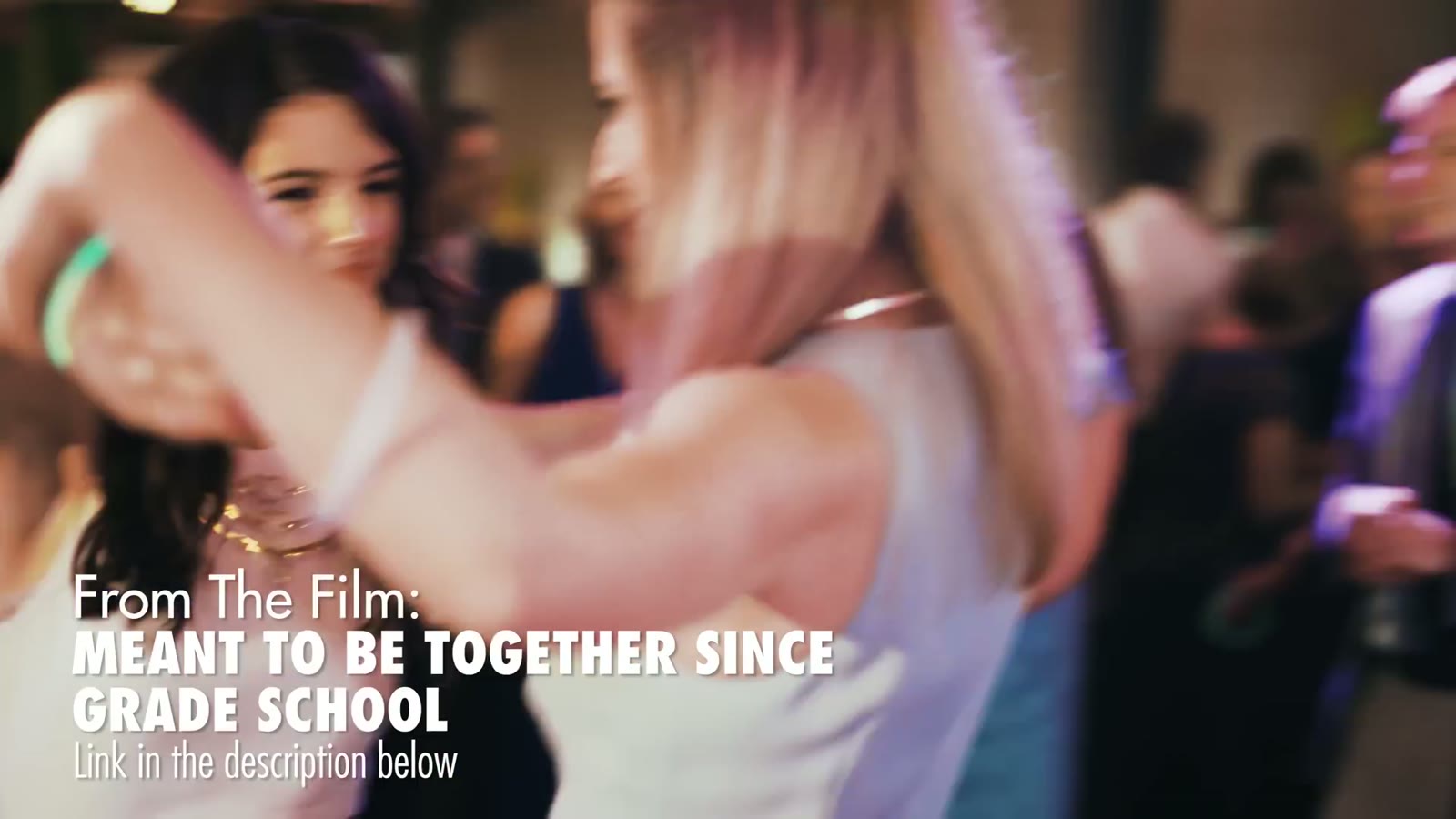 Two women dancing arm in arm, captioned 'From The Film: Meant To Be Together Since Grade School'