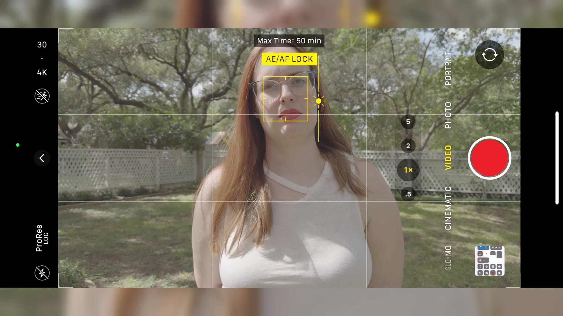 The iPhone camera app showing the yellow AE/AF LOCK box after tapping and holding on a subject