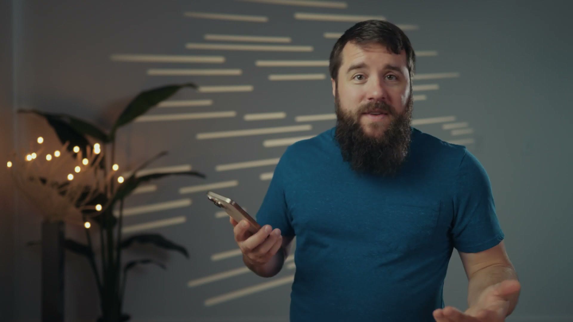 Matt holding an iPhone vertically in one hand