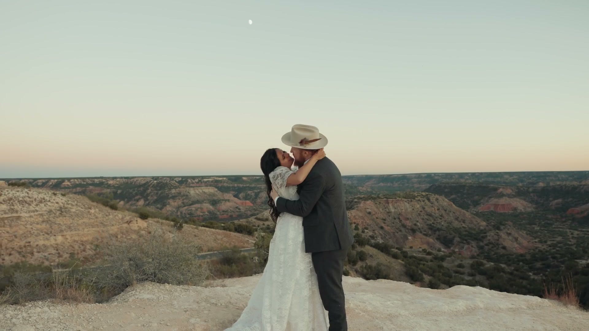 The couple kissing at blue hour