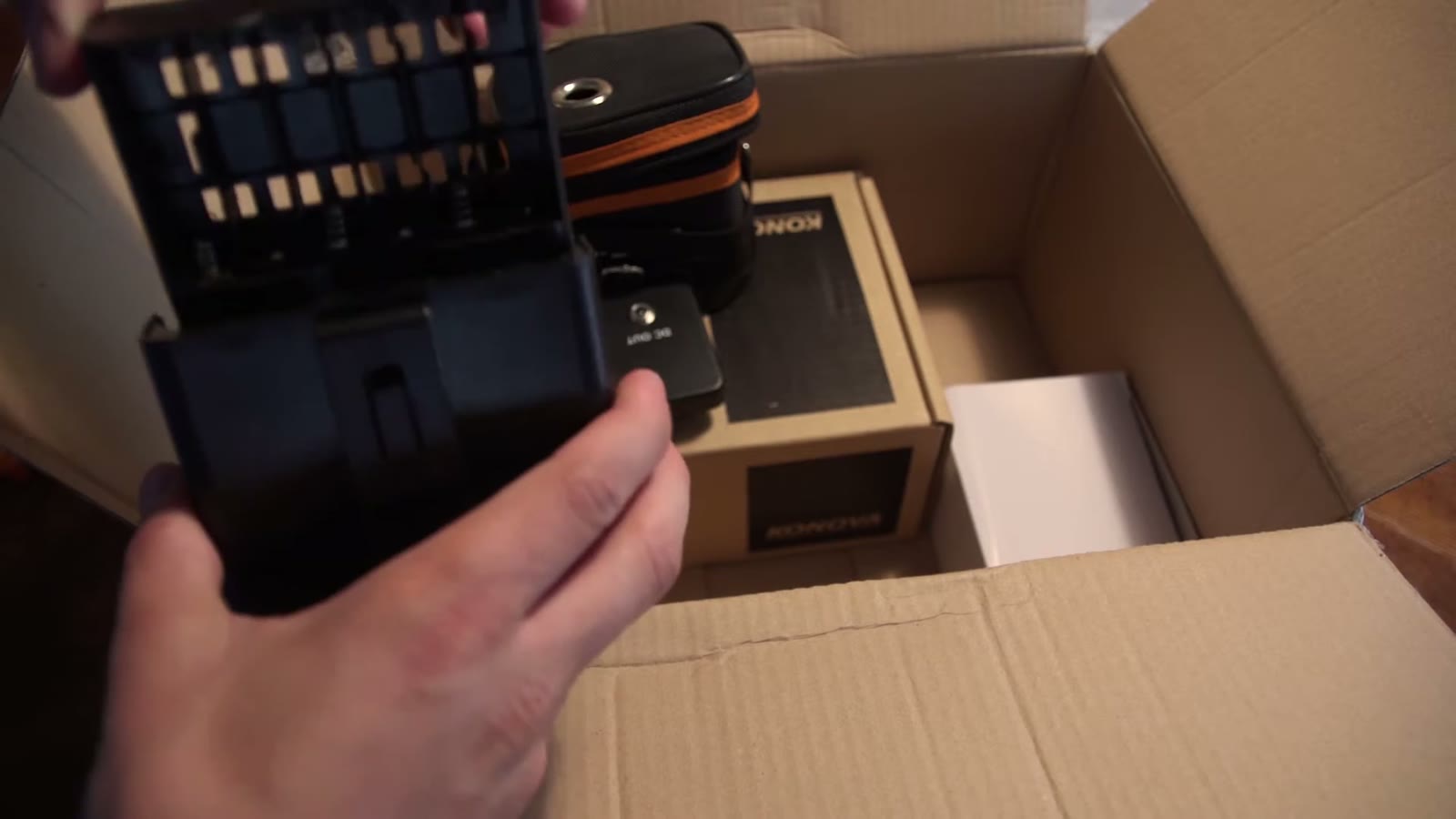 Battery tray that holds twelve AA batteries