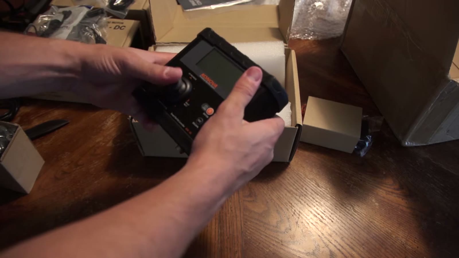 Konova Smart Pan Tilt Controller held in one hand