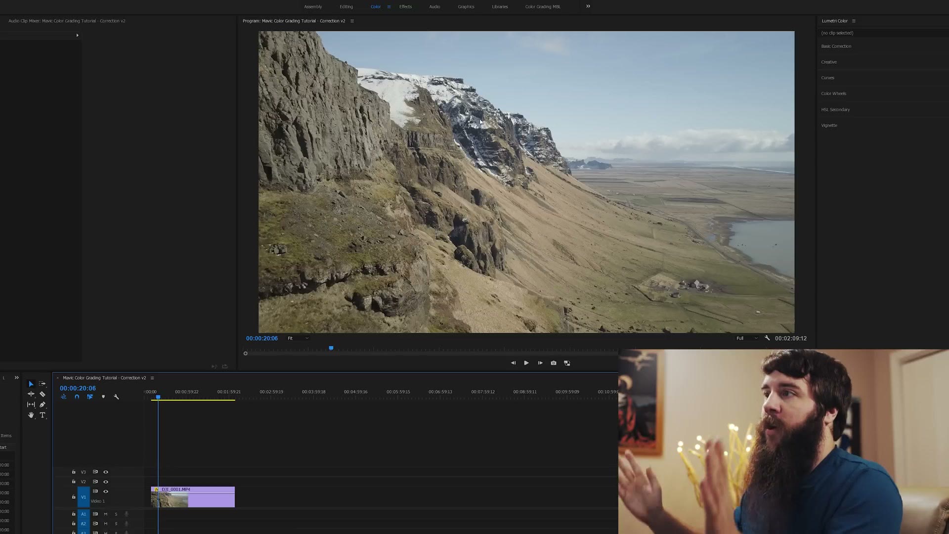 Premiere Pro with a flat, ungraded D-Log drone clip of an Icelandic mountain ridge in the program monitor and the Lumetri Color panel open on the right