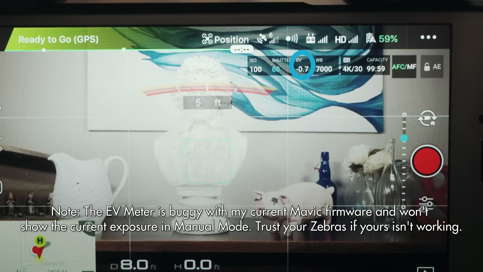 A DJI Go flight screen showing ISO 100, shutter 60, EV minus 0.7, white balance 7000 and 4K 30, with a note that the EV meter is buggy on this firmware