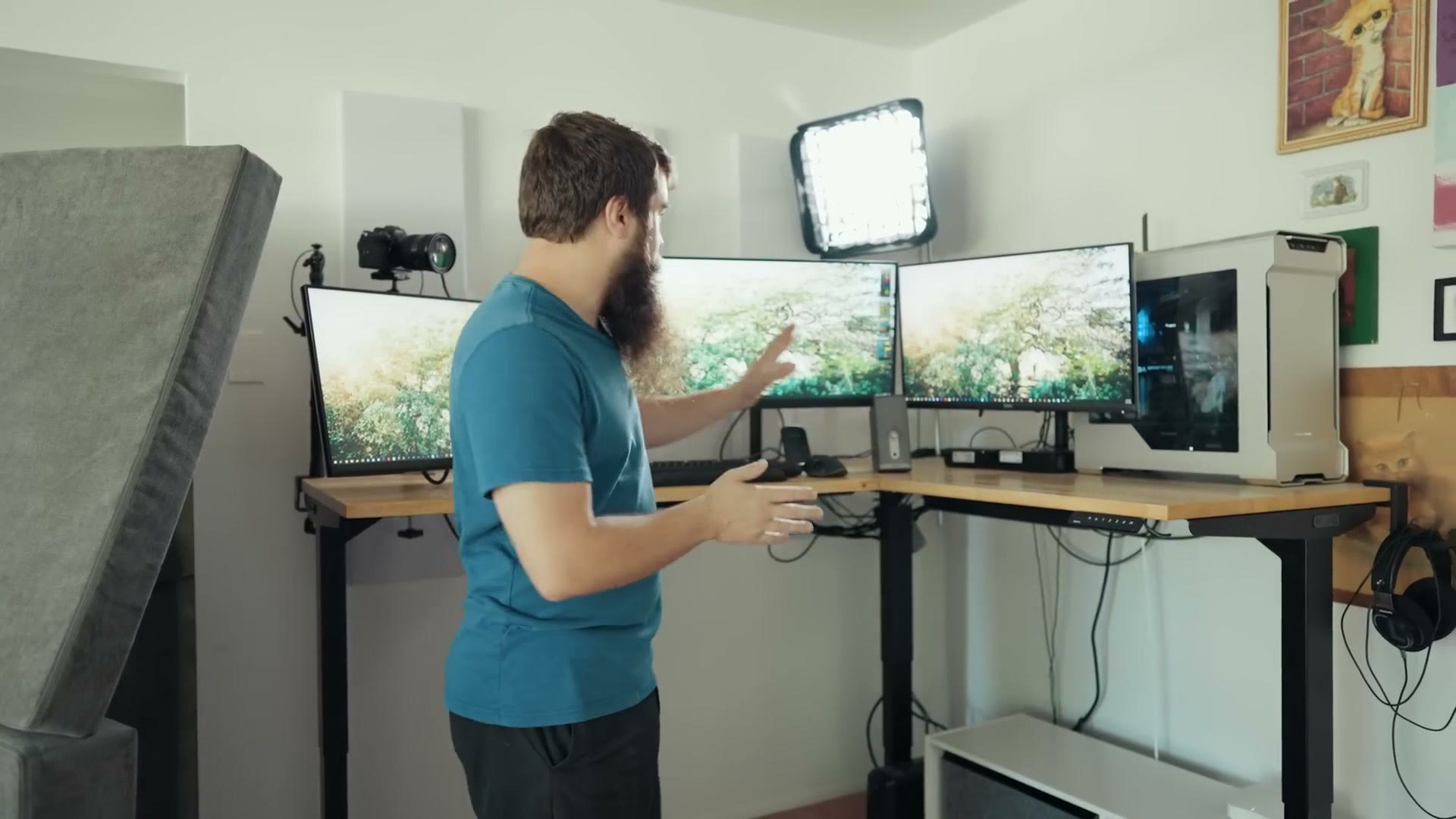 Monitors floating above the desk on monitor arms