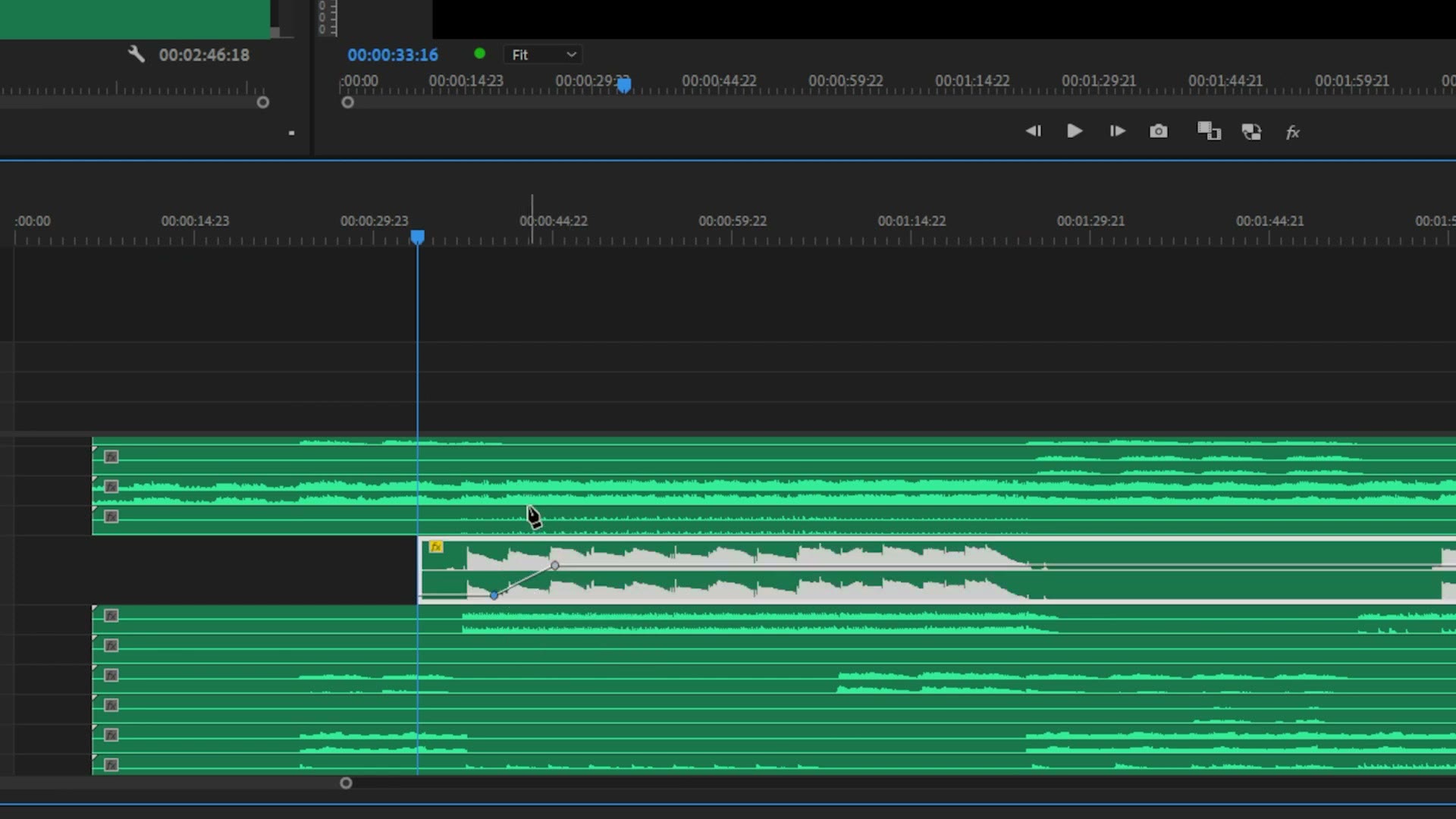 A Premiere Pro timeline with multiple green audio stem tracks stacked up