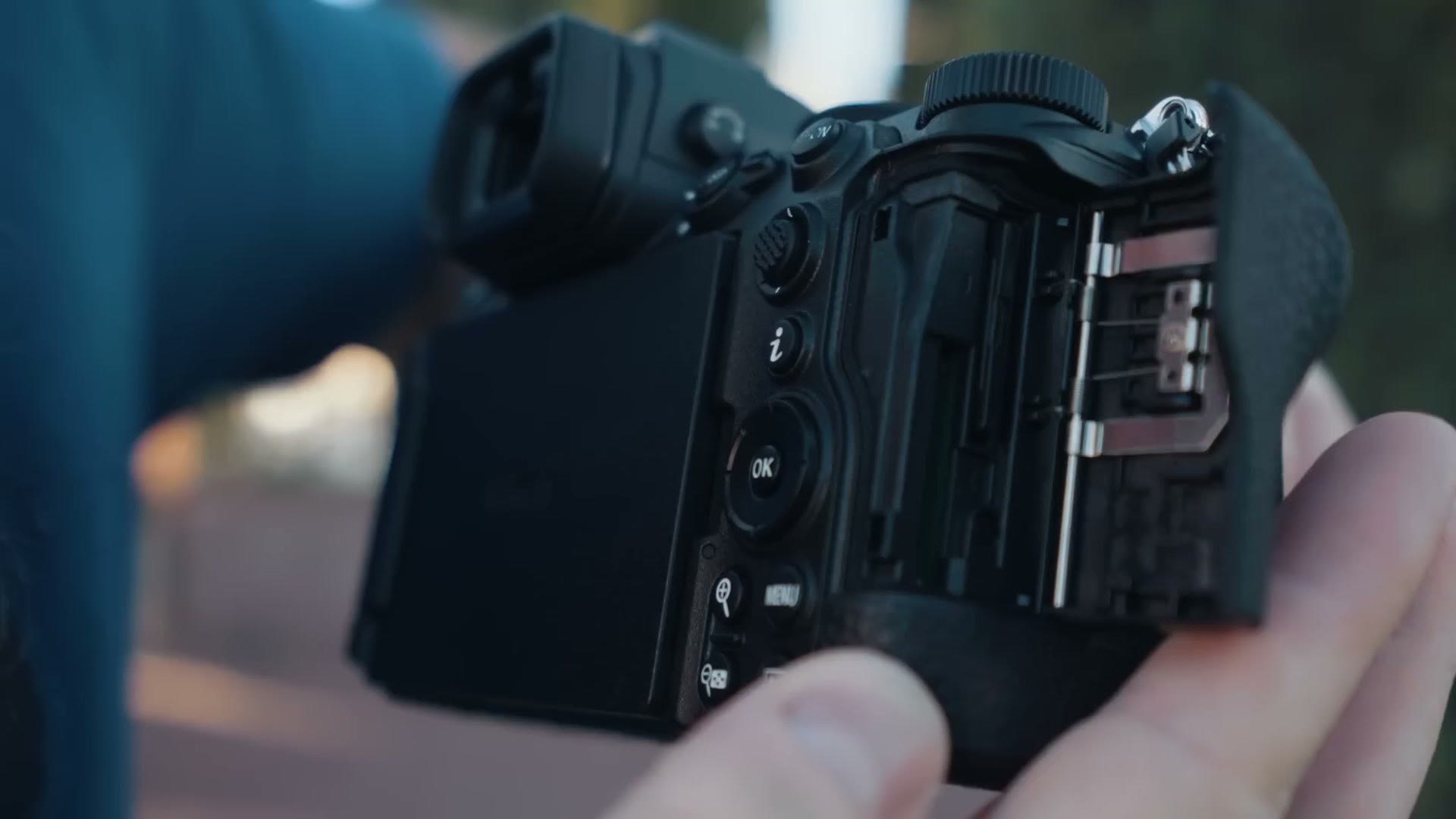 The Nikon Z5ii with its memory card door open, showing two SD card slots and no CF Express slot
