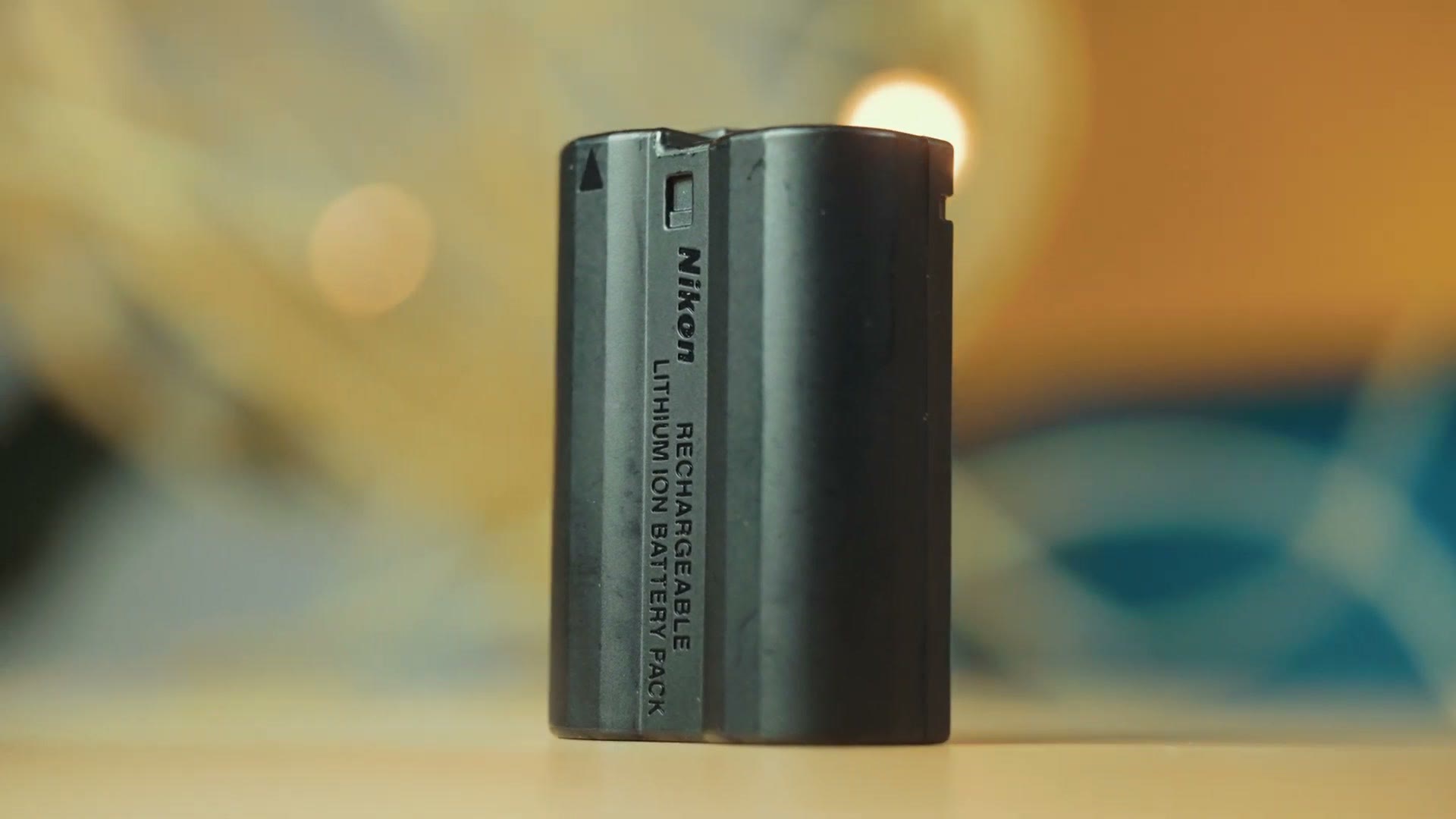 Nikon rechargeable lithium ion battery pack on a table