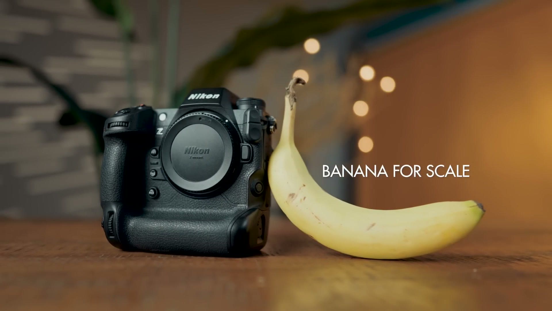 Nikon Z9 on a table next to a banana for scale