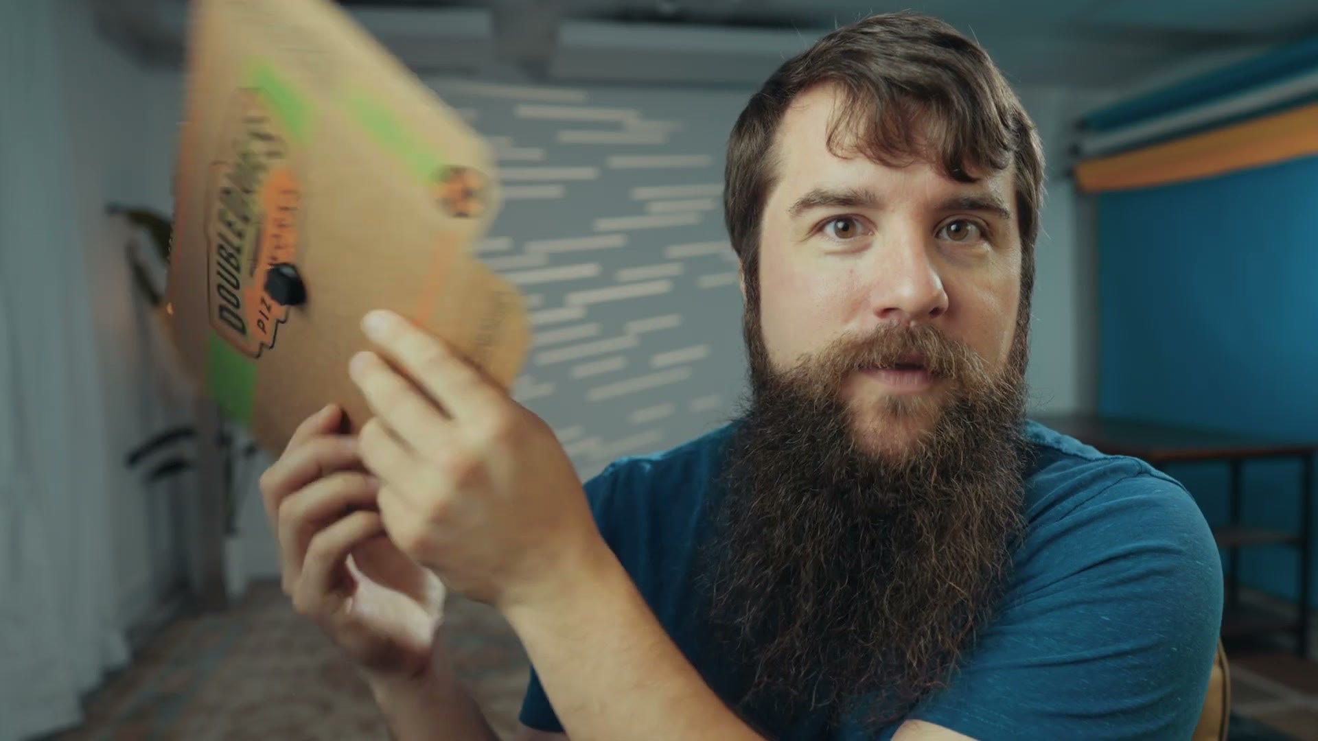 Matt holding up a pizza box
