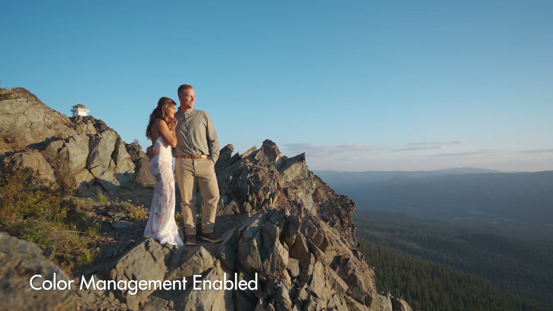 The same mountain ridge shot now bright and saturated with a blue sky, labeled Color Management Enabled