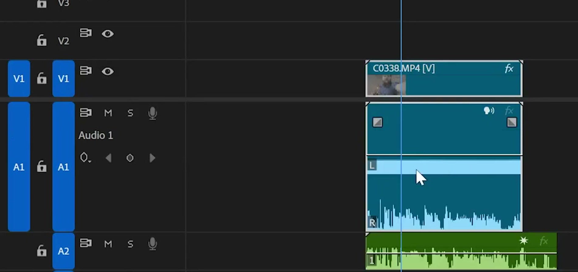 Premiere Pro timeline showing a camera audio clip where the left channel is a solid block and the right is a normal waveform