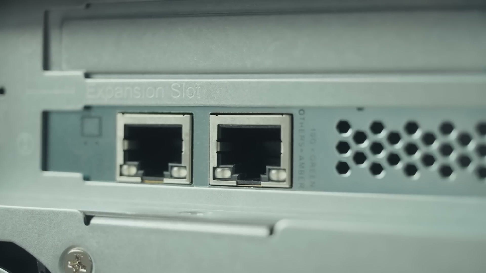 Close up of the two 2.5 gigabit Ethernet ports and the expansion slot on the back of the NAS