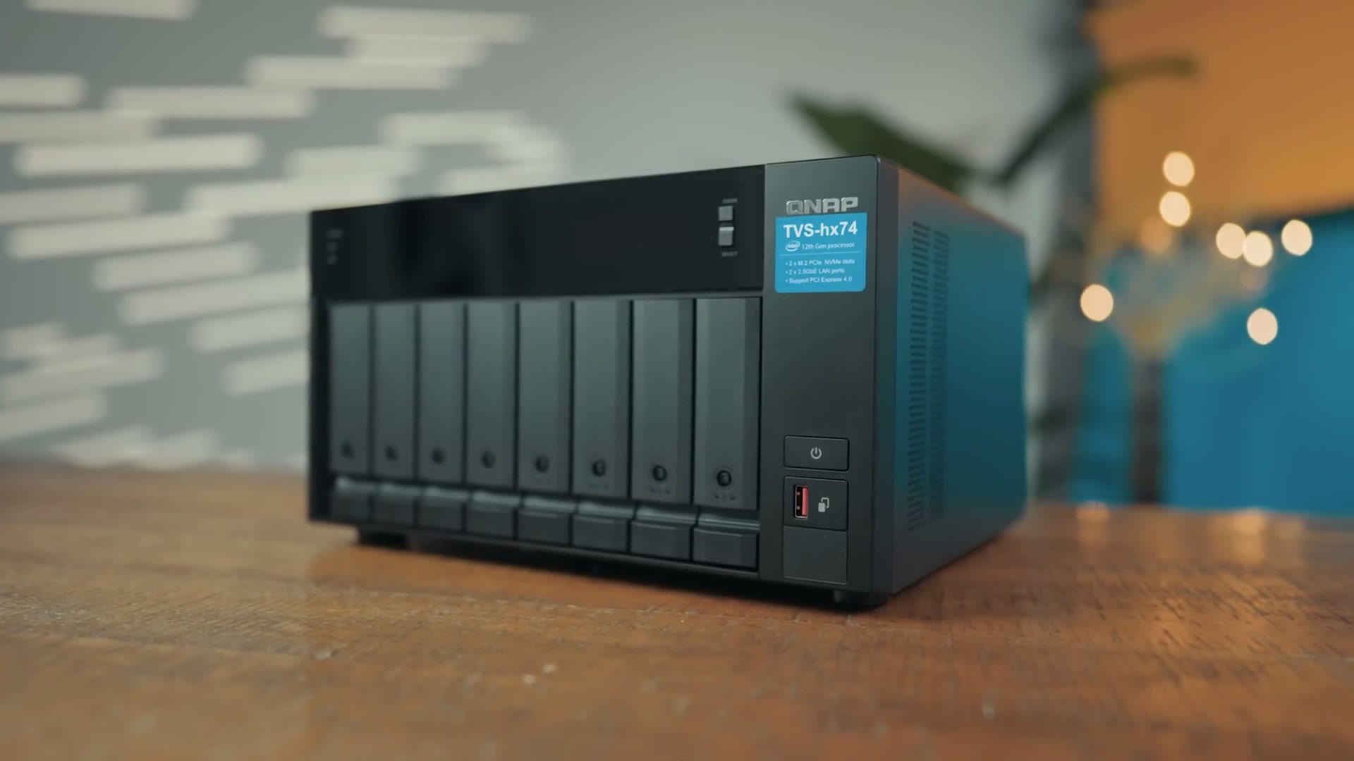 QNAP TVS-h874 eight bay NAS sitting on a wooden table