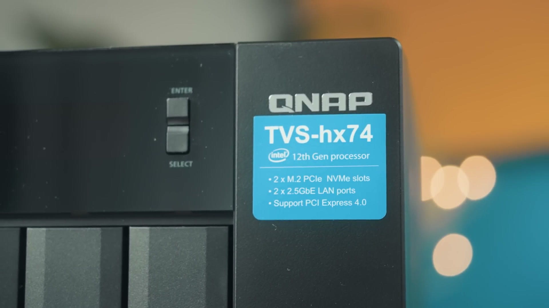 Close up of the QNAP TVS-hx74 badge listing 2 x M.2 PCIe NVMe slots, 2 x 2.5GbE LAN ports and PCI Express 4.0 support