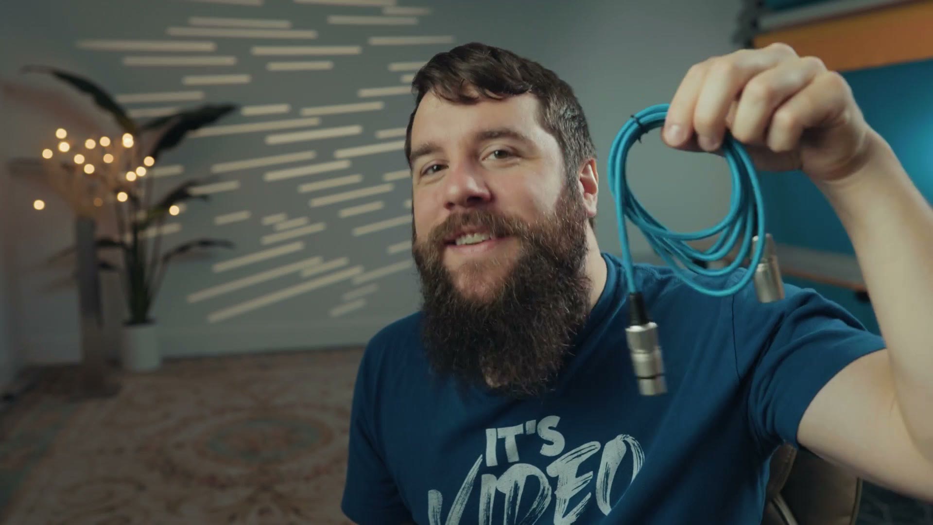 Matt holding the quarter inch to XLR cable