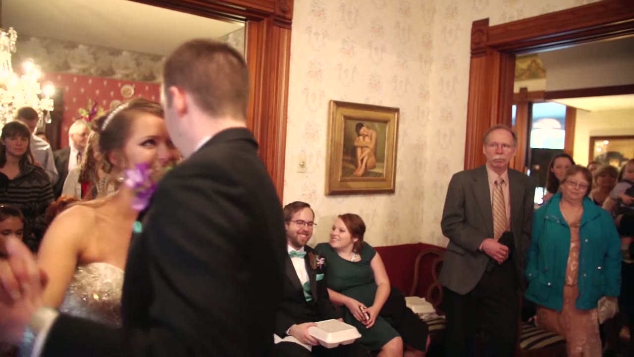 Bride and groom entering the reception room at the Calvert Inn as seated guests look on