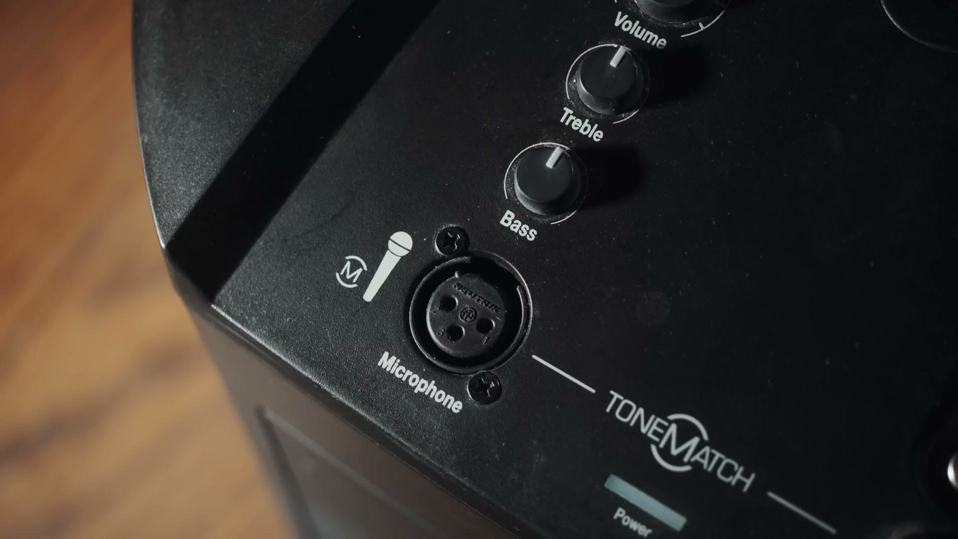 Close up of the Bose ToneMatch control panel showing an XLR microphone input with Volume, Treble and Bass knobs