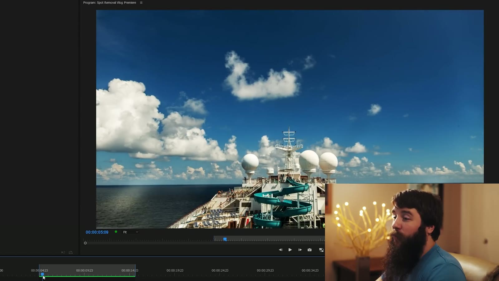 A cruise ship timelapse clip open in the Premiere Pro program monitor, clouds over the ship's deck