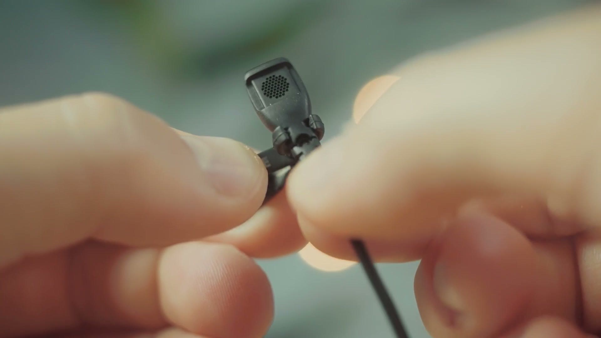 A close look at the Rode lav clip with the white Rode logo on it
