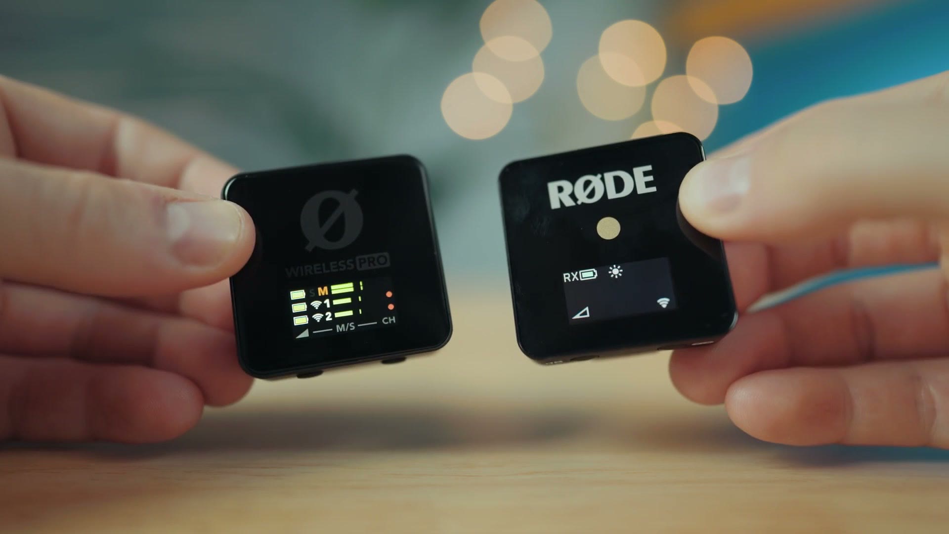 A Rode Wireless GO and a Rode Wireless PRO held side by side