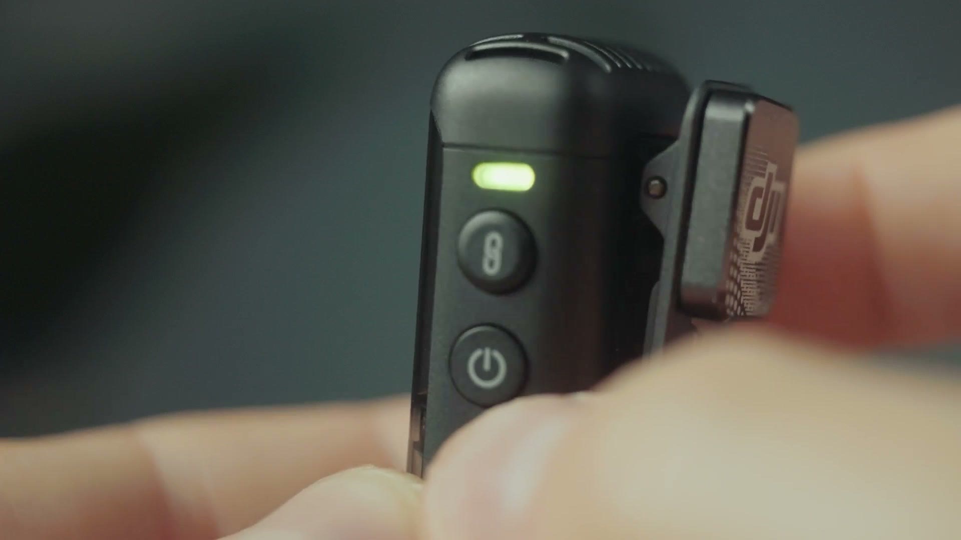 Close-up of the record and power buttons on the Rode Wireless PRO transmitter
