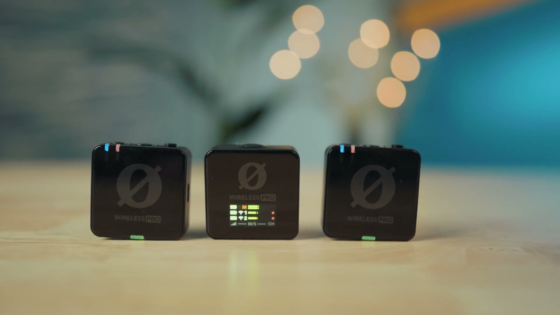 The Rode Wireless PRO receiver and two transmitters standing on a table