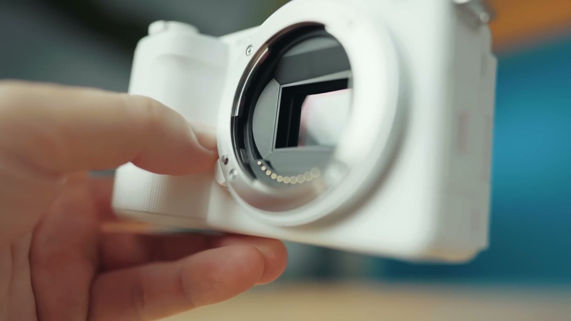 Front of the white Sony ZV-E10 II showing the empty lens mount