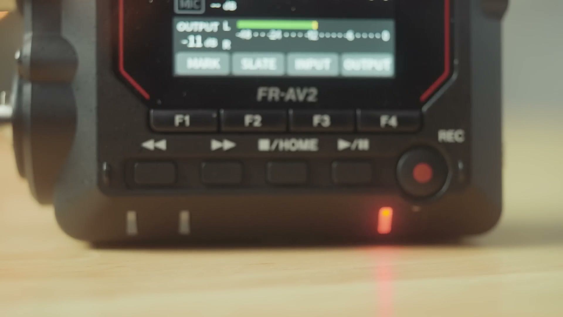 Function buttons and record button on the Tascam FR-AV2 with the record light lit