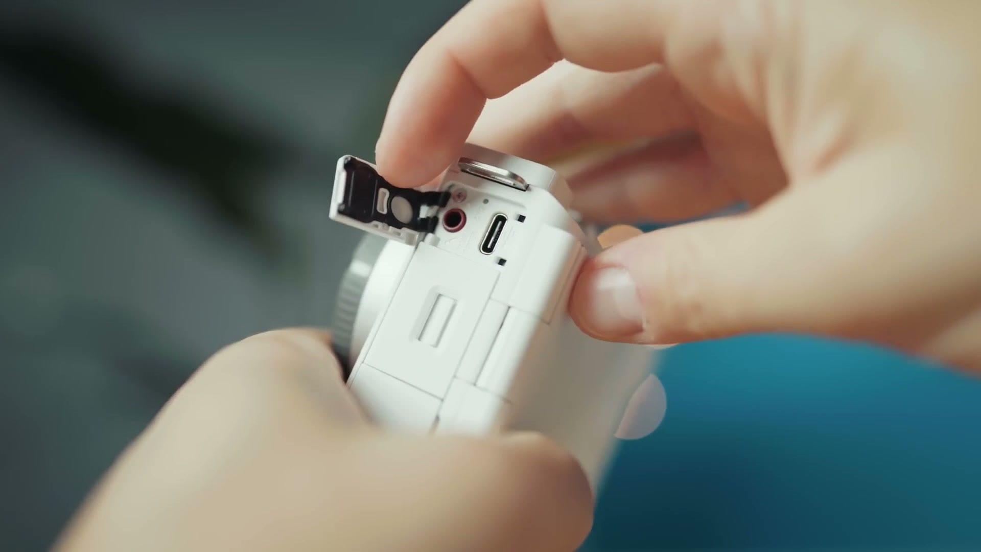 Side door of the Sony ZV-E10 II open showing its ports