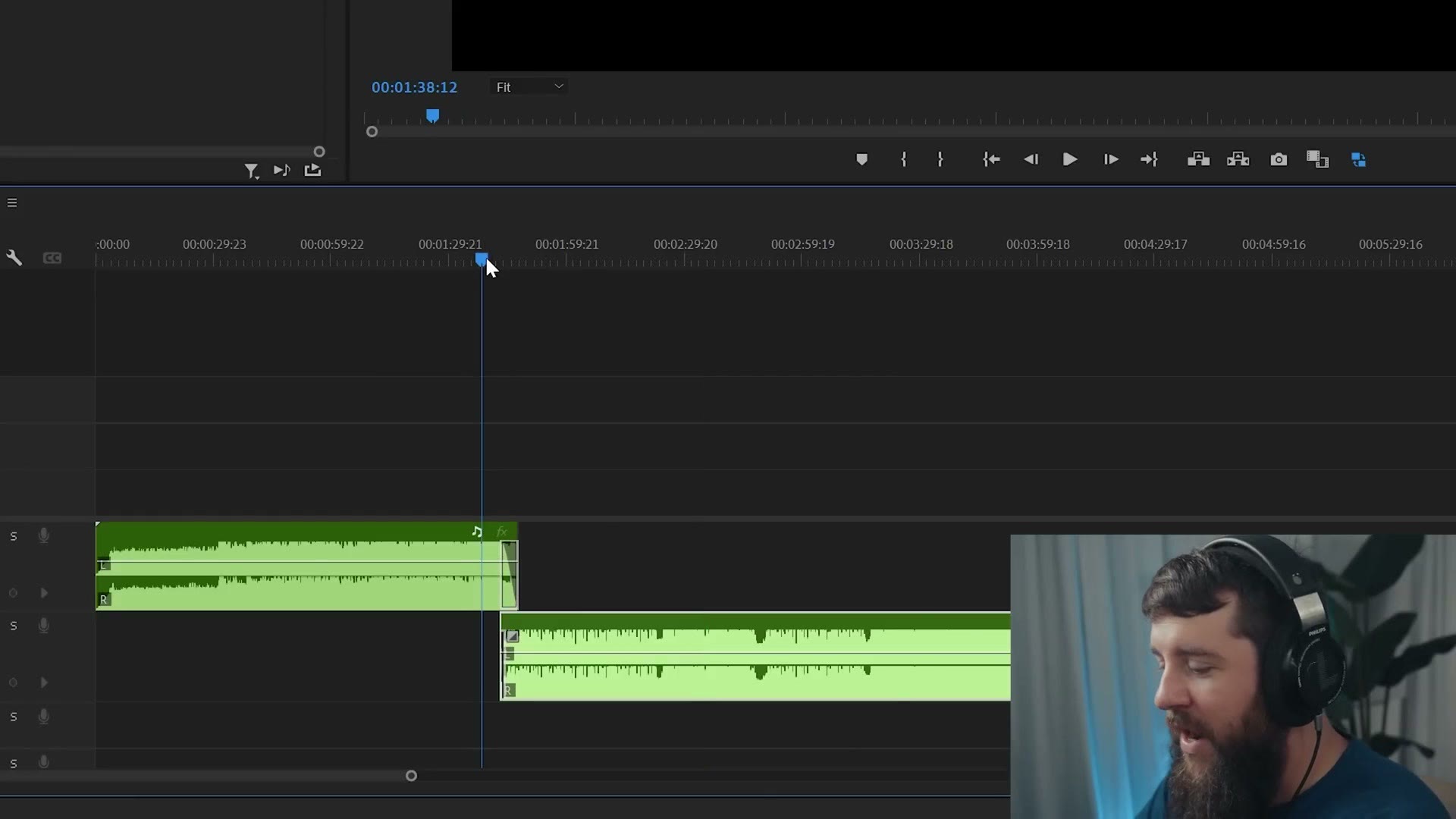 Premiere Pro timeline with two audio clips crossfading between each other