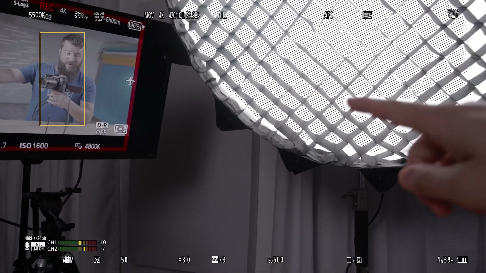 Camera preview showing zebra stripes over a bright light modifier