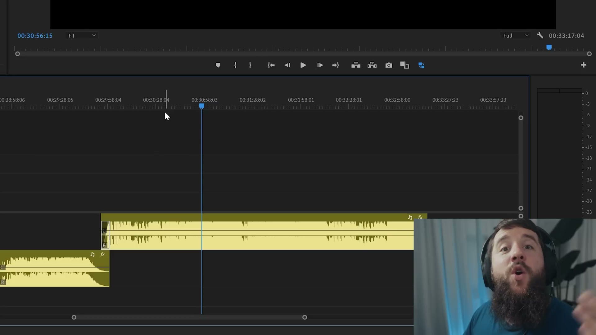 Premiere Pro timeline showing a long audio crossfade between two songs