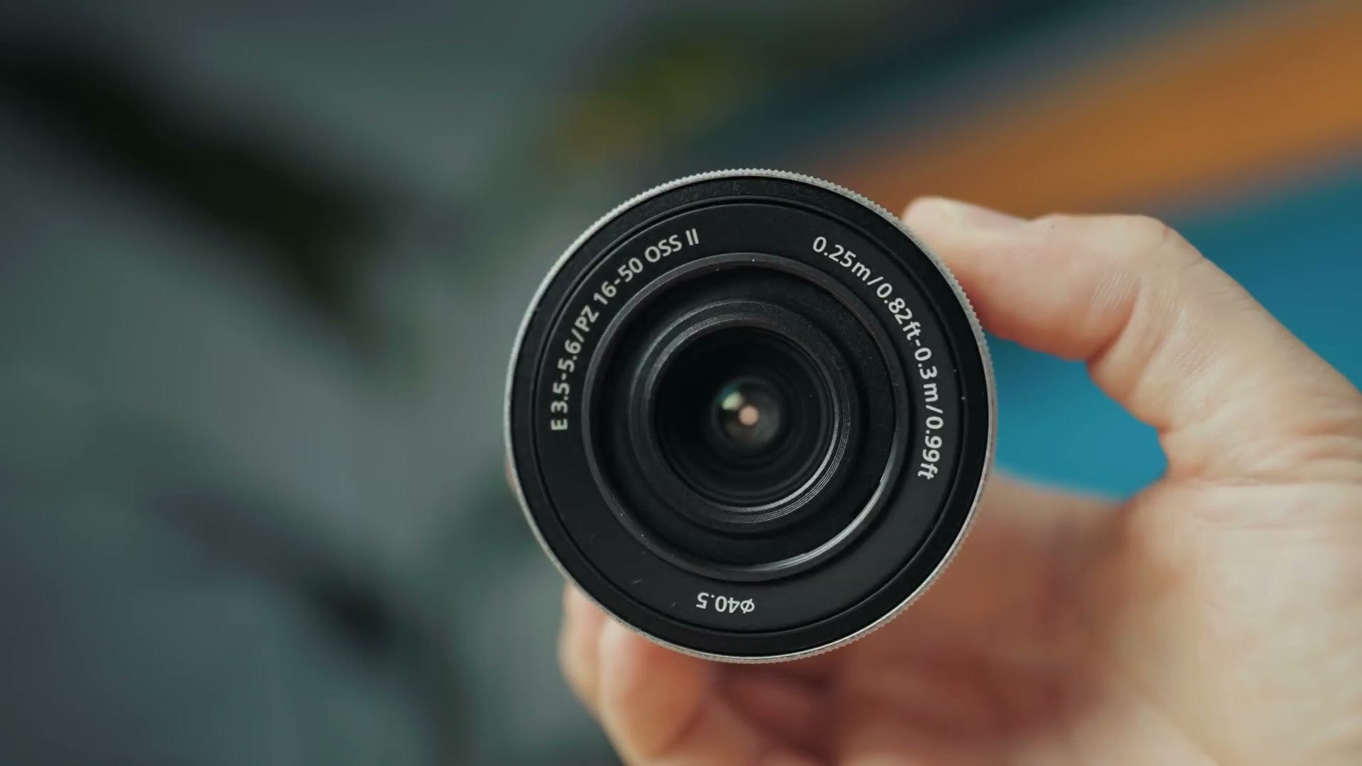 Sony 16-50mm power zoom kit lens held in hand