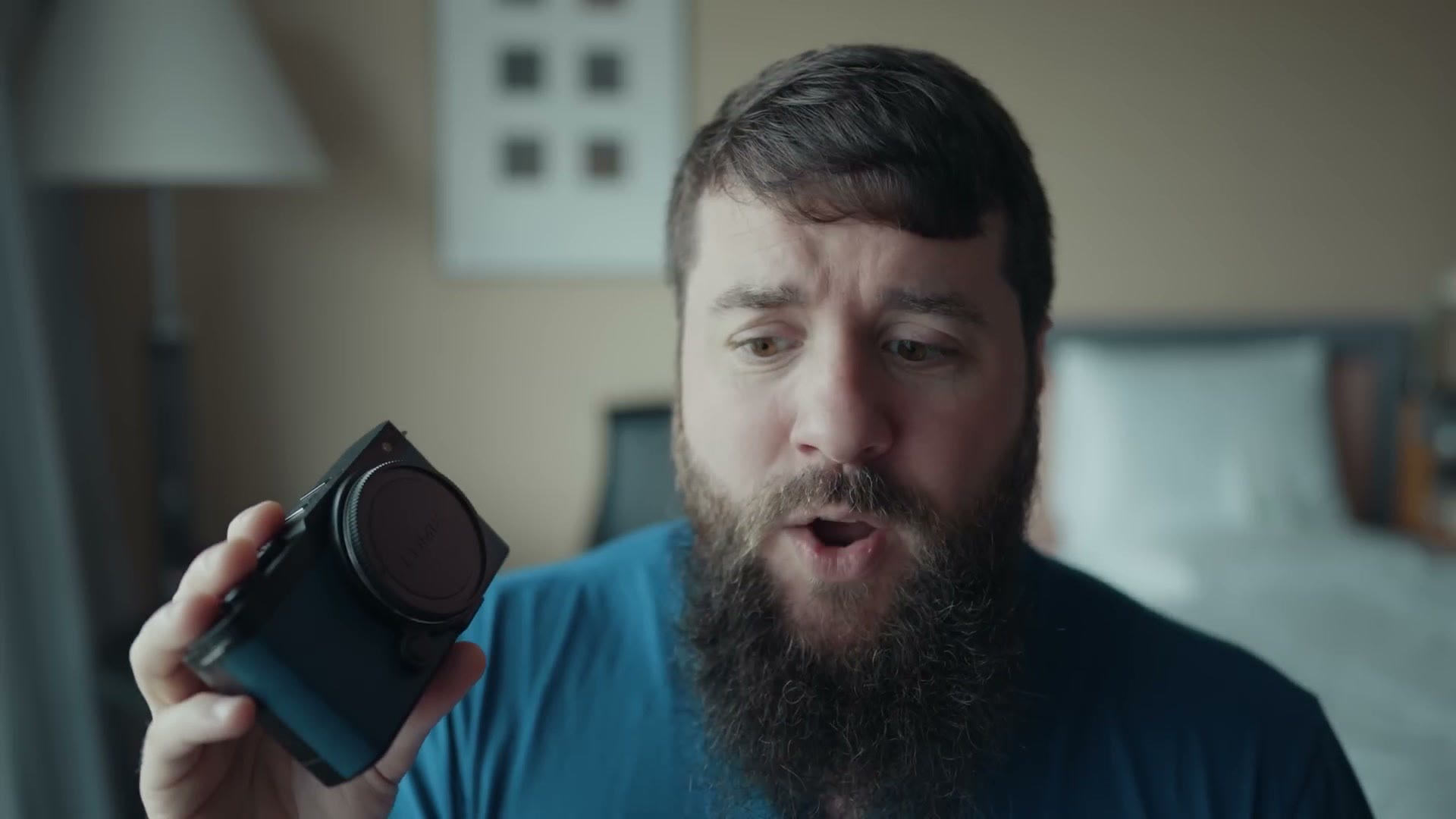 Matt Johnson holding the Panasonic Lumix S9 camera