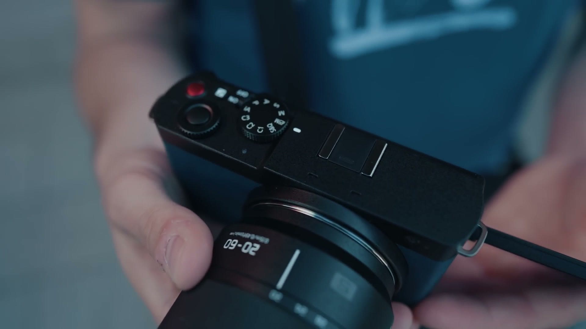 Top plate of the Panasonic Lumix S9 showing the dial and red record button