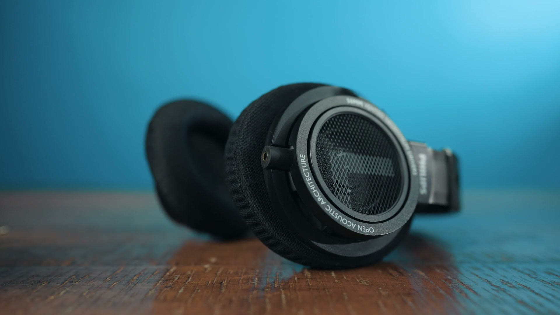 The Philips SHP9500 headphones on a table with the detachable cable